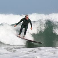 an old man surfing